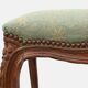 Louis XV stool with carved floral apron and original damask upholstery