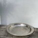 Round silver-plated metal serving dish with hallmark
