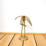 Brass heron head down