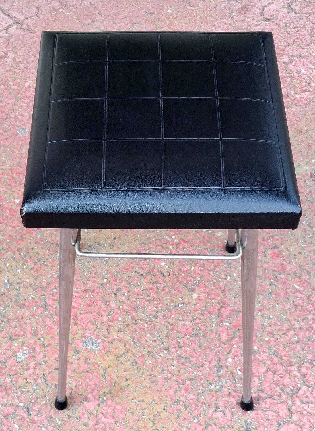 Black faux leather and chrome stool. 1970s, vintage seventies decor.