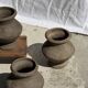 Small brutalist handcrafted terracotta vase with a pedestal, Indonesian, H19 D17.