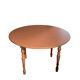 Round wooden table with drop-leaf sides