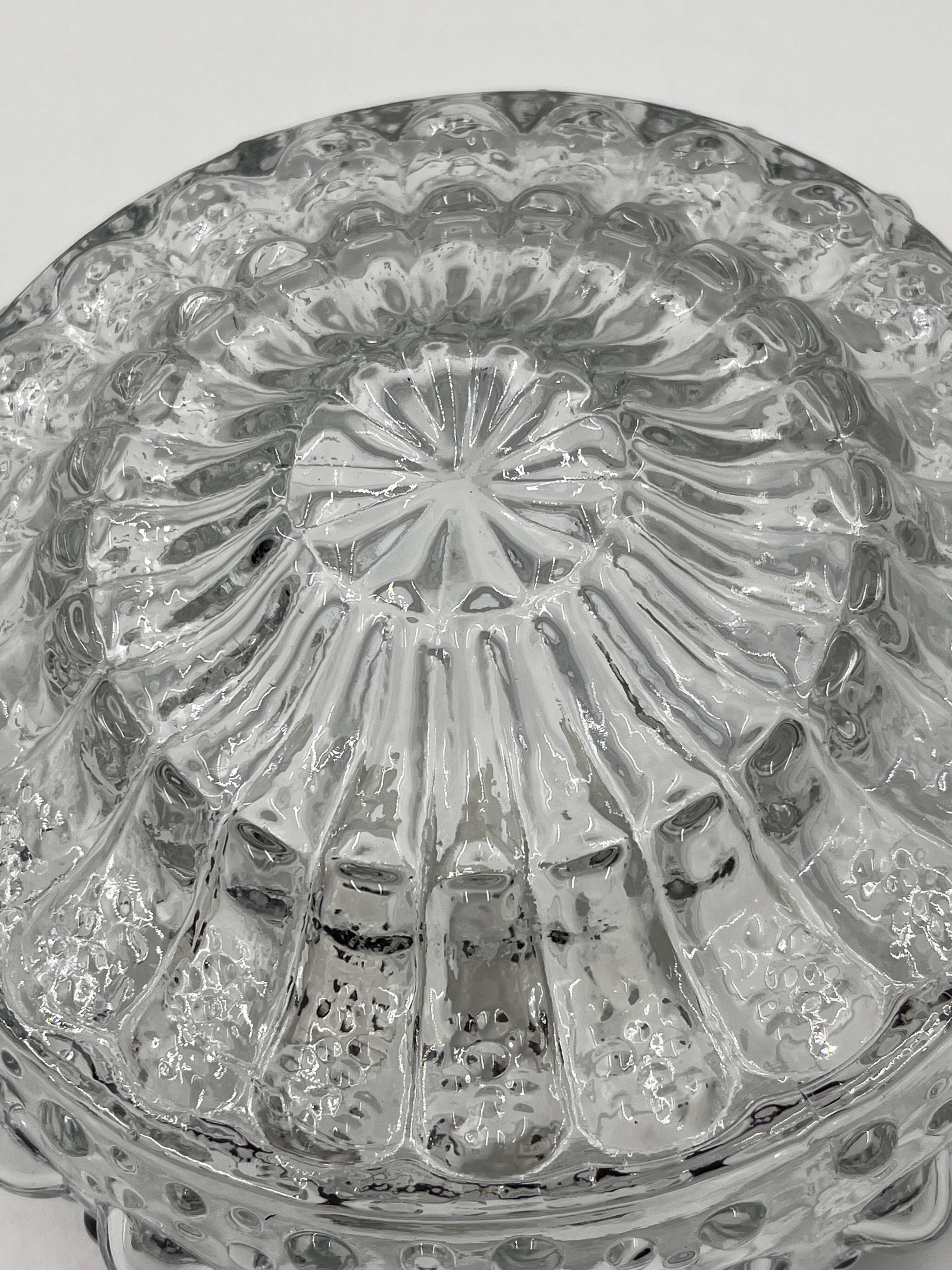 Molded glass ceiling light with spinning top relief