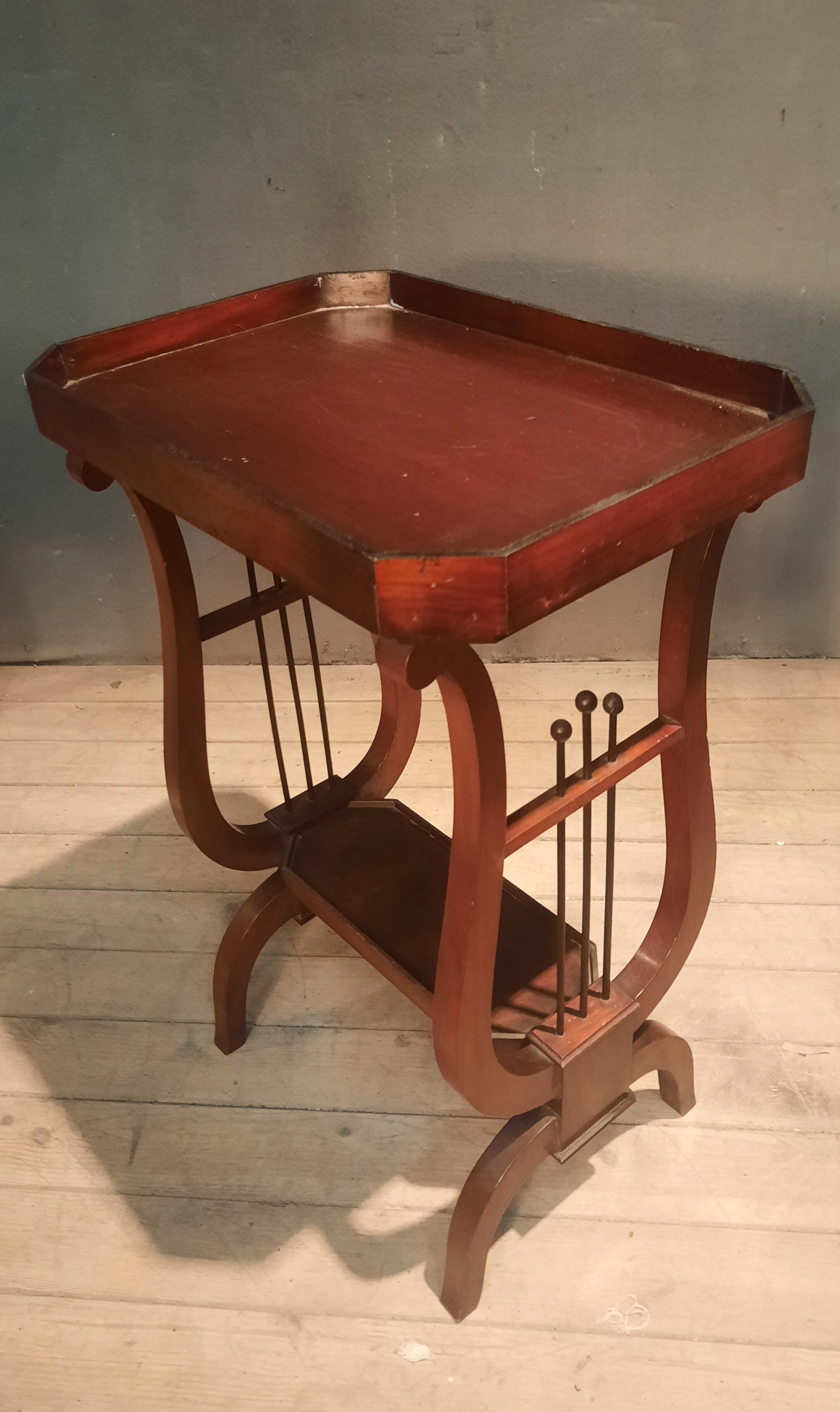 19th-century worker with a lyre footstool.