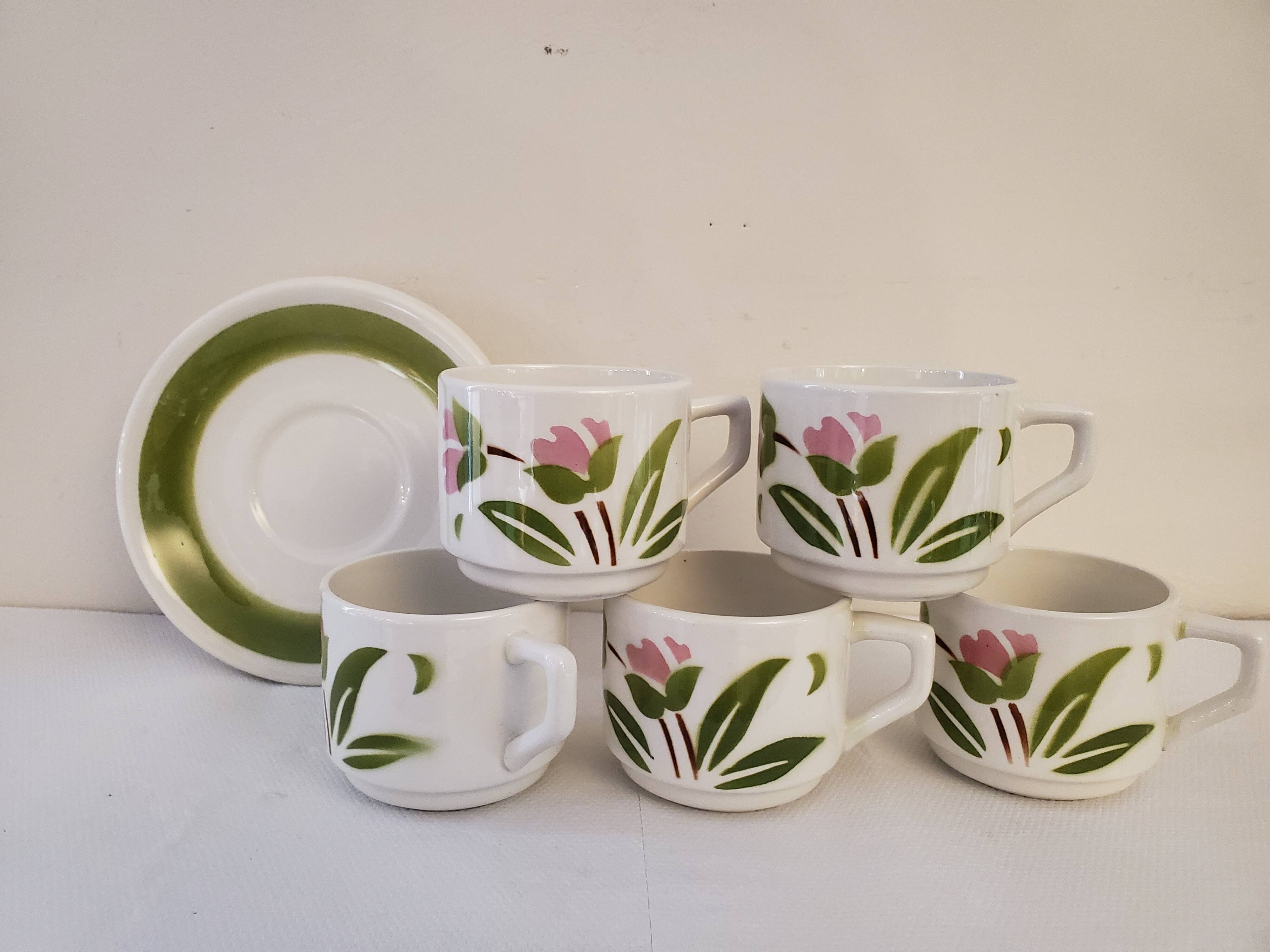 5 cups and ceramic saucers