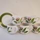 5 cups and ceramic saucers