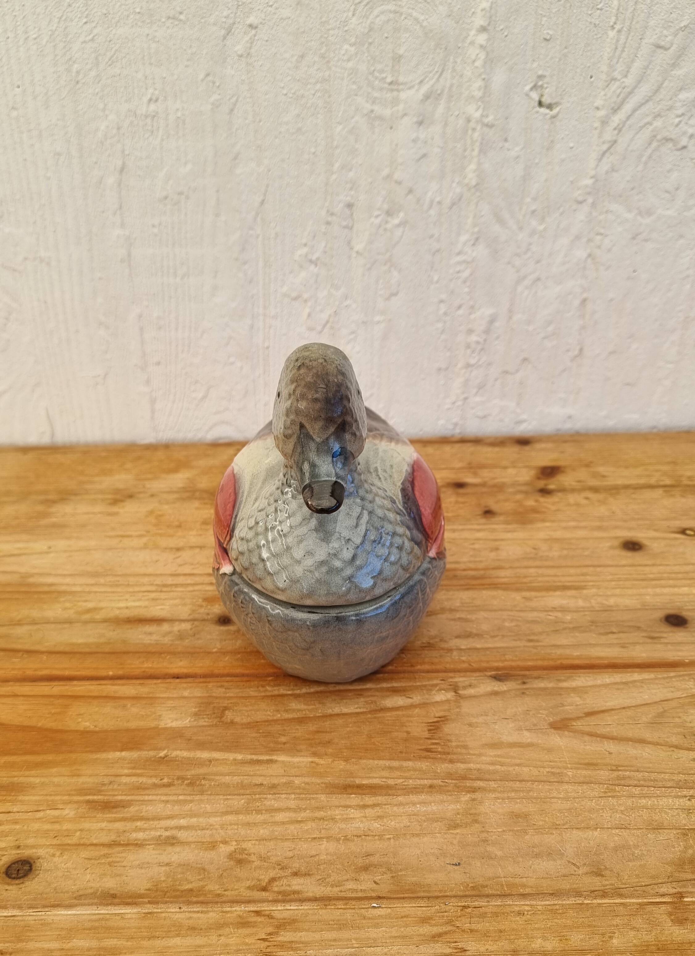 Antique earthenware terrine in the shape of a duck.
