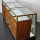 Counter or shop window in oak glass and brass France around 1920