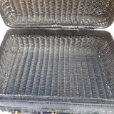 Old black wicker suitcase