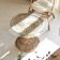 Table basse diabolo en rotin et plateau en verre