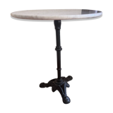 Marble side table with a cast iron base.