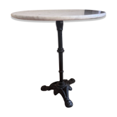 Marble side table with a cast iron base.