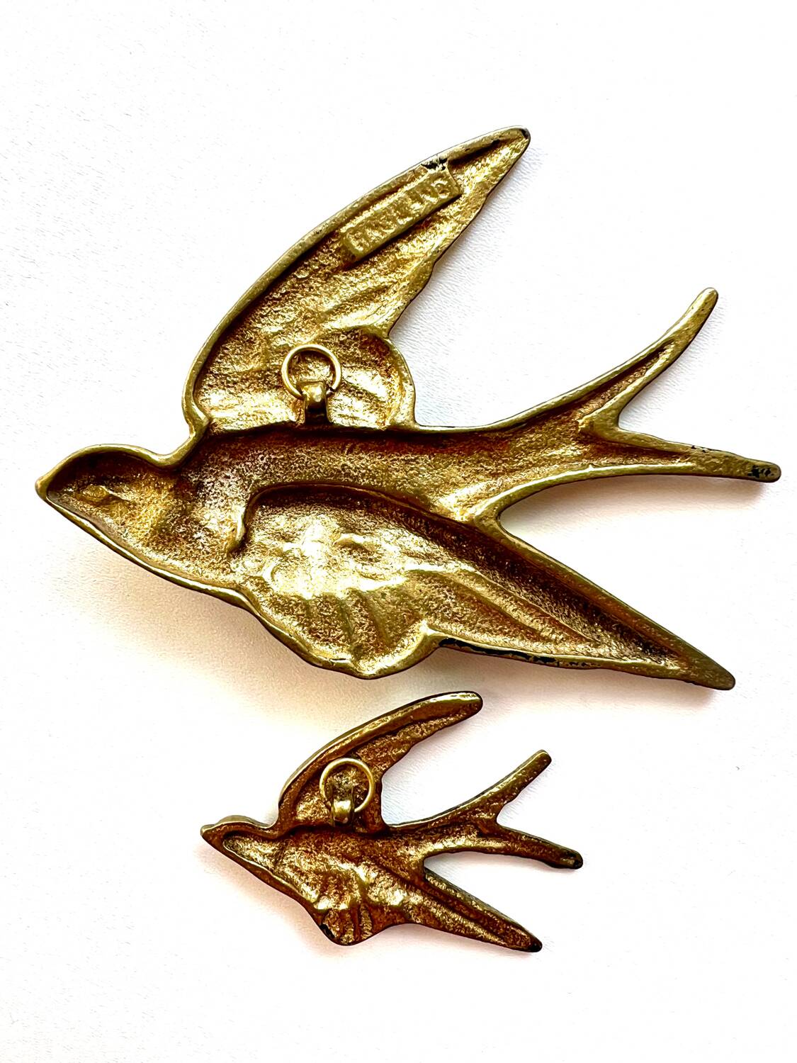 Pair of copper swallows