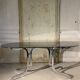 Table à manger design année 70 en chrome et verre fumé