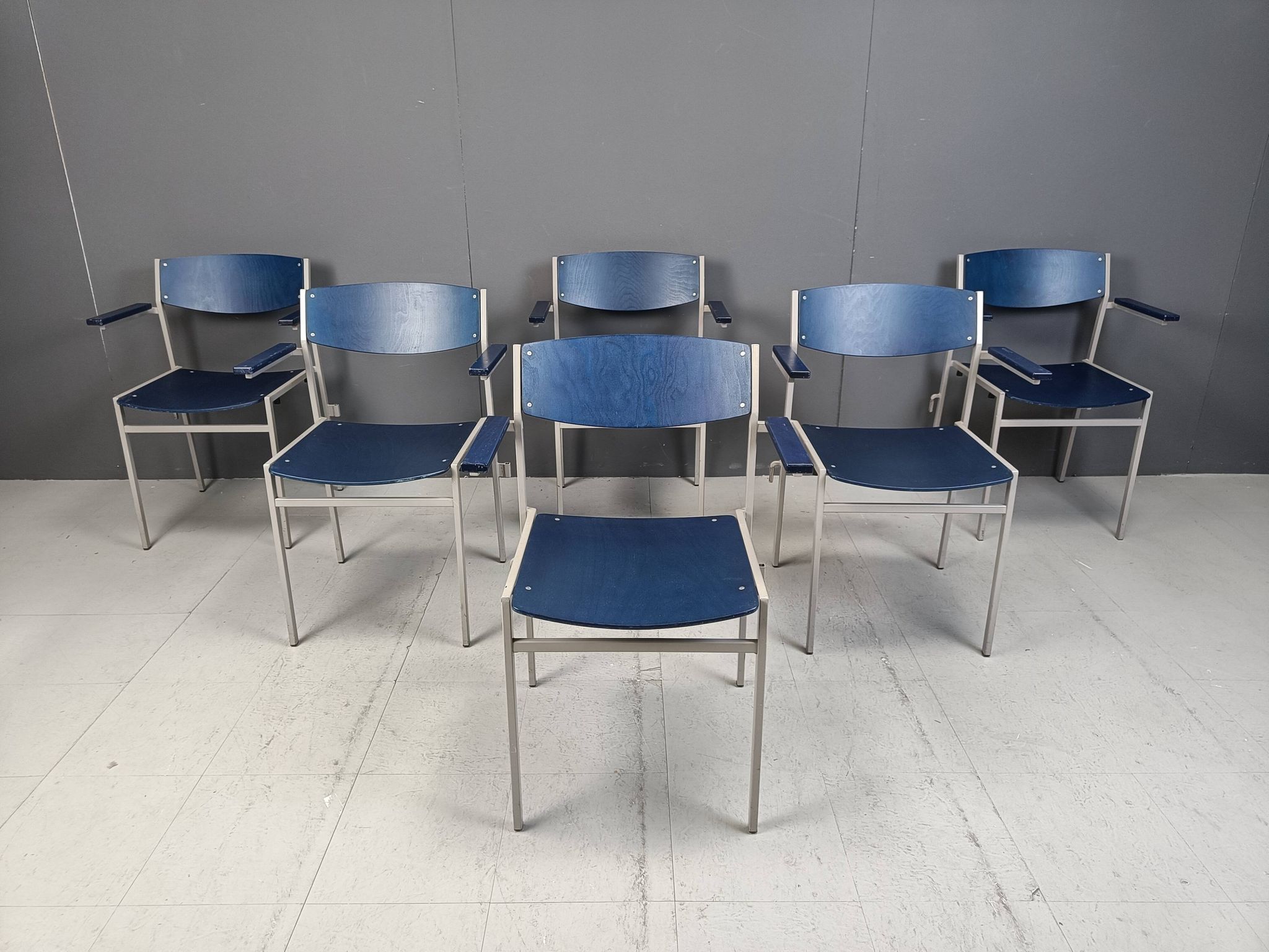 Minimalist metal and plywood stackable armchairs by Gijs Van Der Sluis