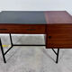 French modernist desk from the 1950s with 2 drawers, 1 cabinet, and 1 container.