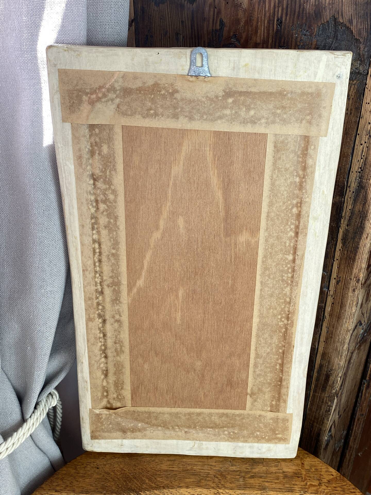 Carved wooden mirror, colourful floral decoration.
