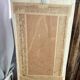 Carved wooden mirror, colourful floral decoration.