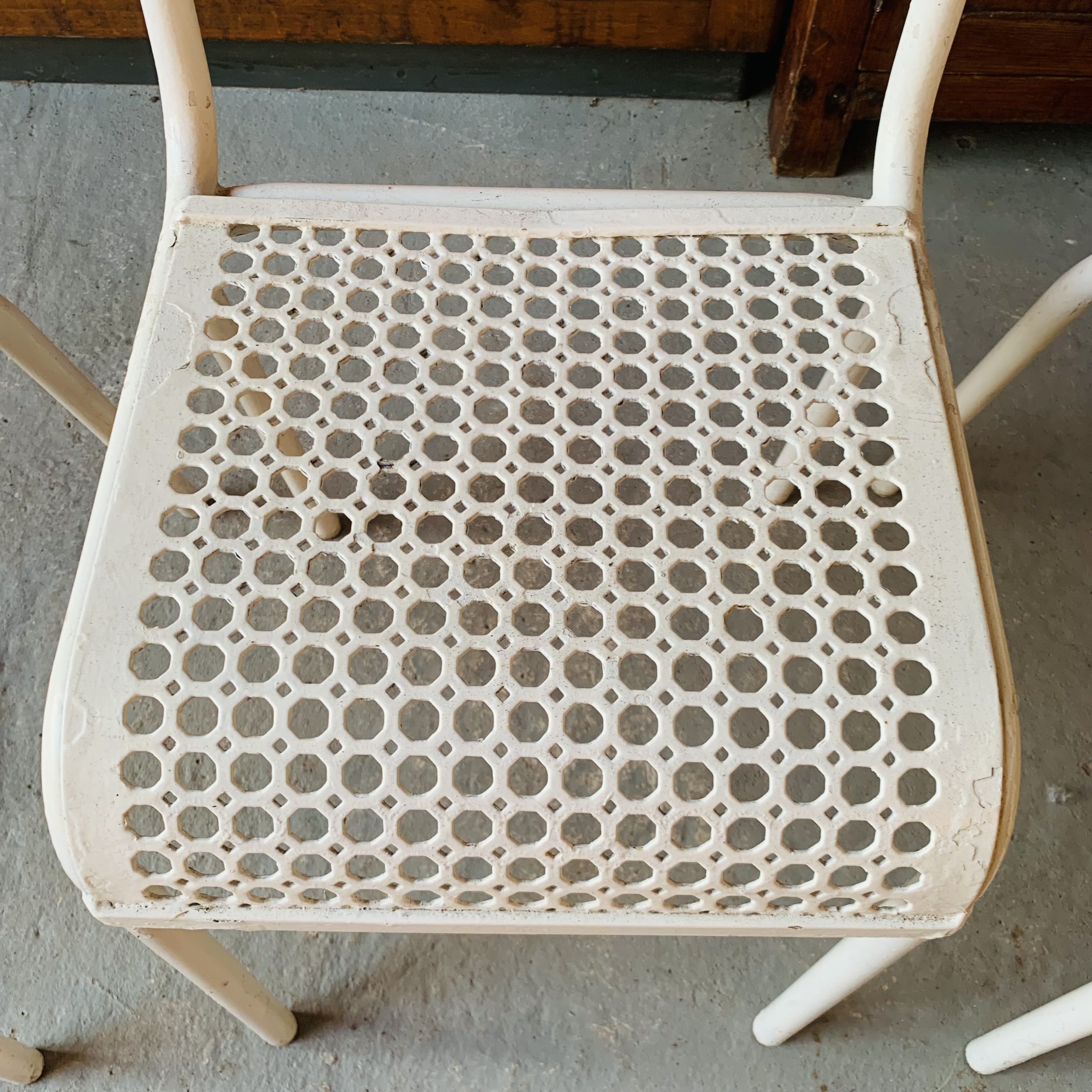 Series of 3 perforated metal chairs
