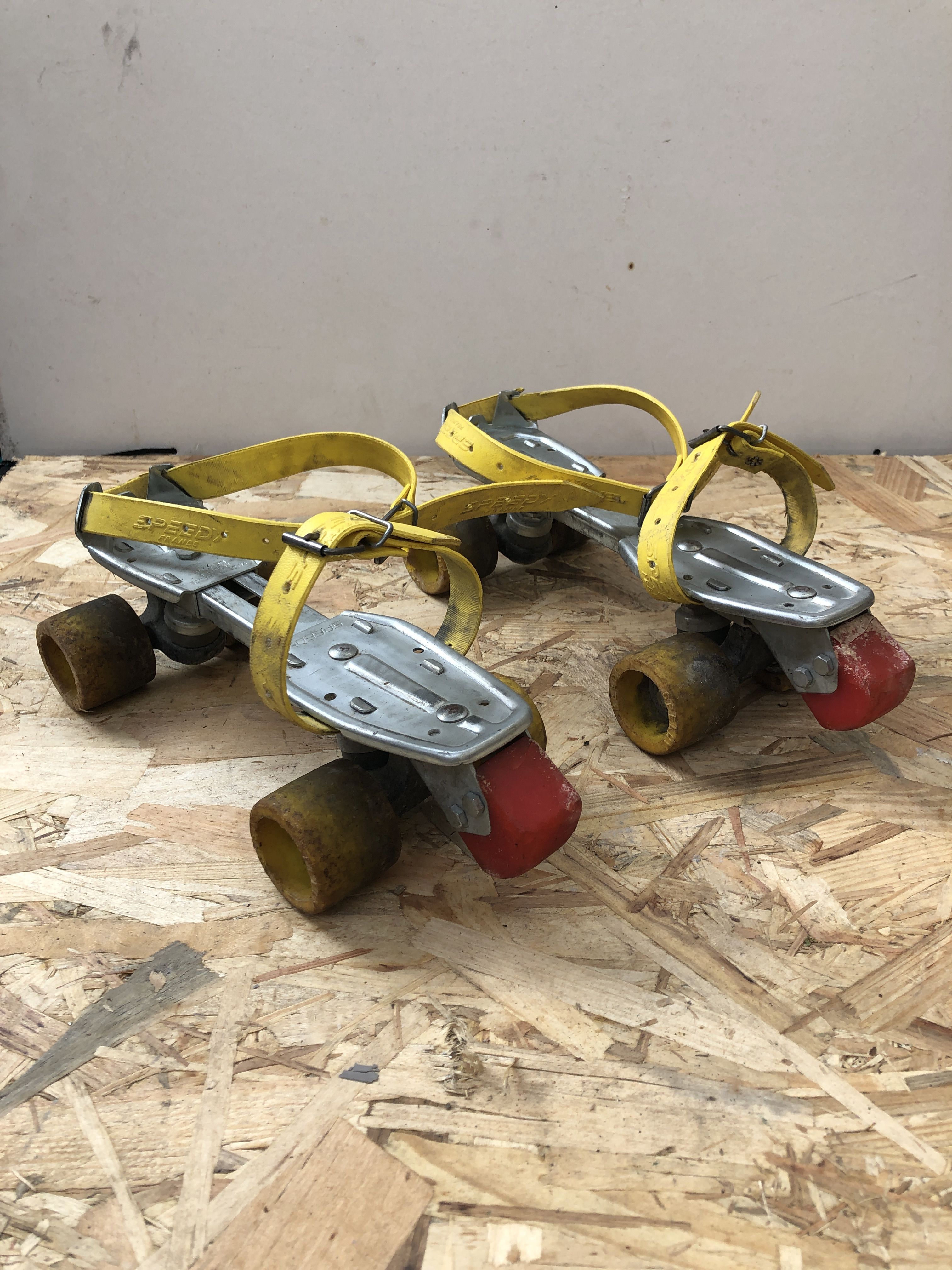 Old pair of speedy metal roller skates grey + straps & vintage brake