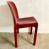 Red chair "selene" by vico magistretti for artemide of the 60s