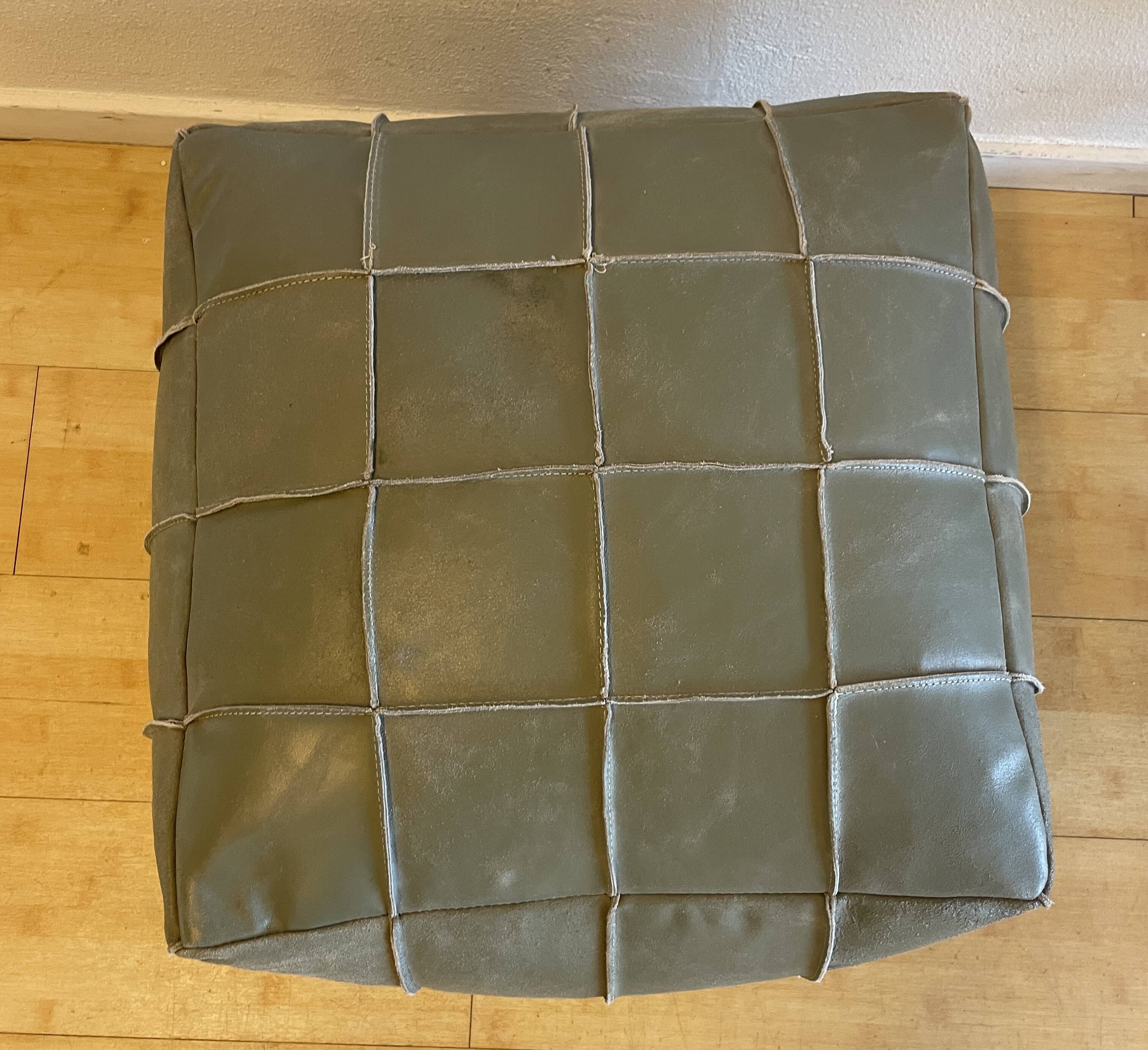 Grey leather pouf