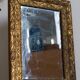 Antique mirror in gilded wood