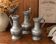 Set of 3 stamped pewter jugs
