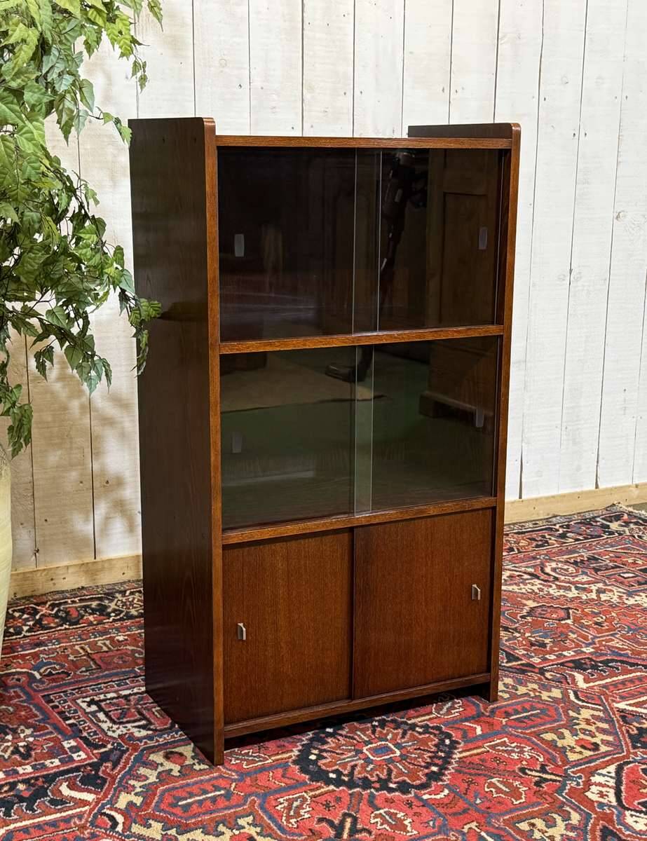 Small English oak library from the 1960s with sliding doors.