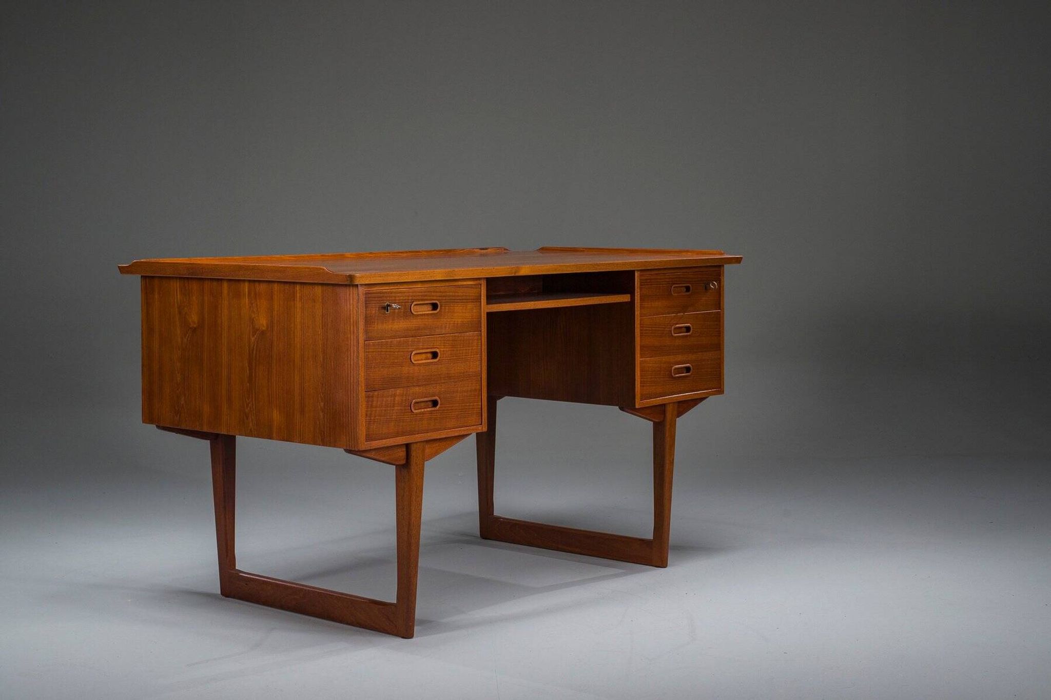 Mid-century Danish freestanding teak desk with raised lip edge, 1960s