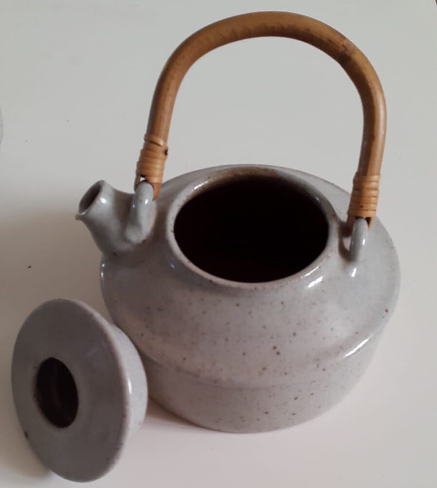 Set of sandstone teapot with rattan handle and six bowls from the 70s