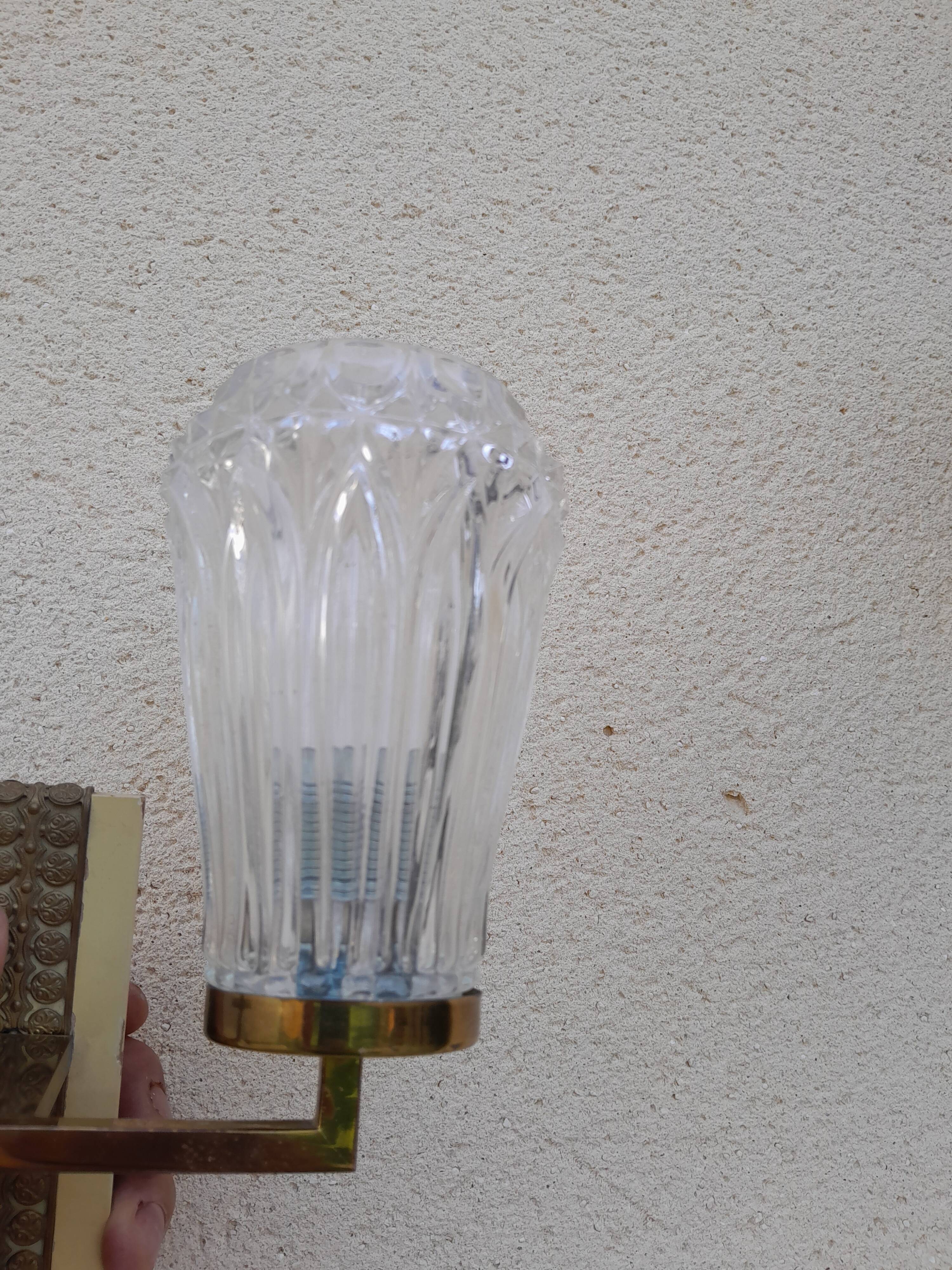 Pair of vintage wall lights from the 50s and 60s in brass glass
