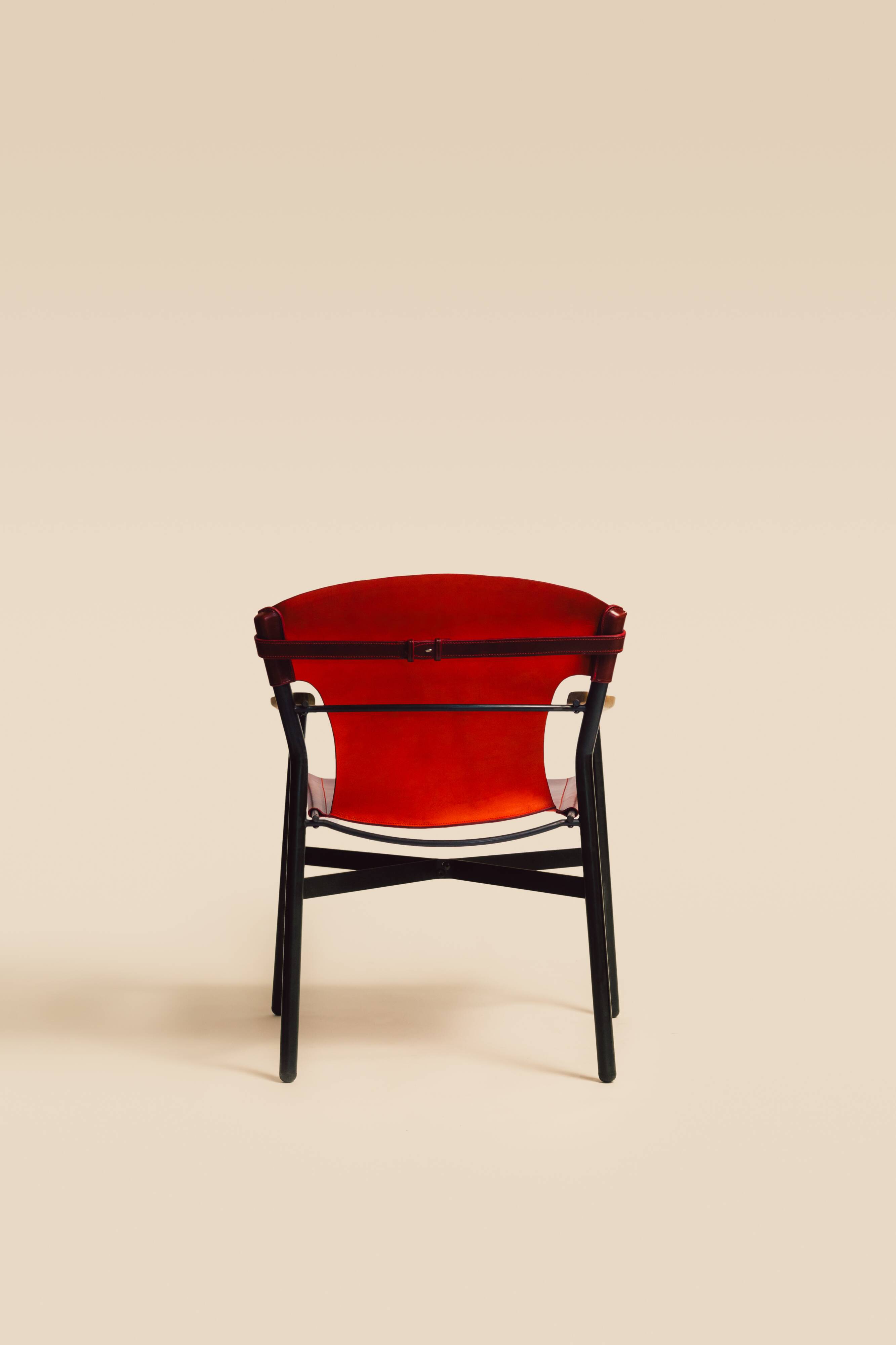 Maërl armchair, Galathée model, red leather, solid wood armrests of your choice