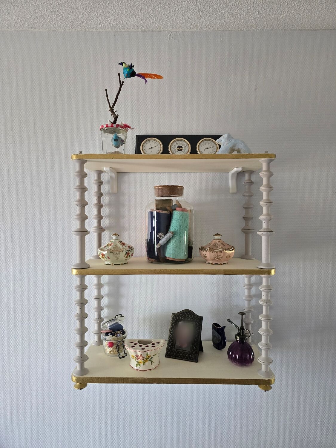 White and gold spool shelf