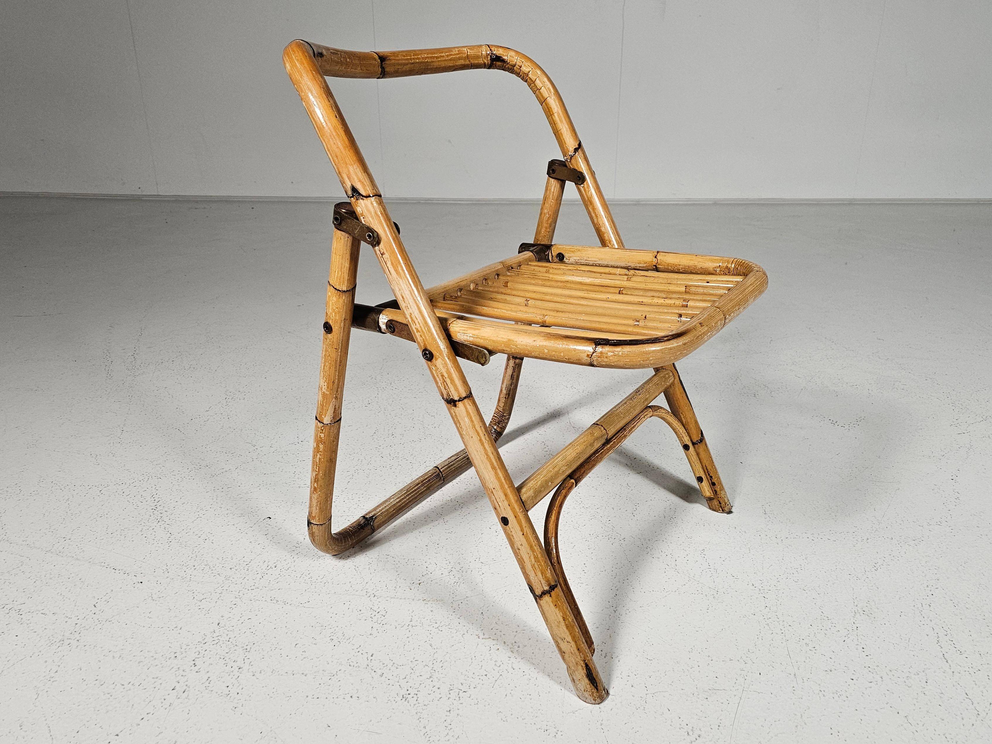 Set of 4 Dal Vera bamboo folding chairs, brass details, Italy, 1960s.