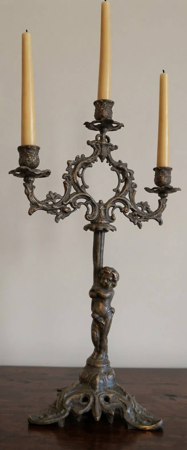 Antique bronze chandelier with putto, 19th century.