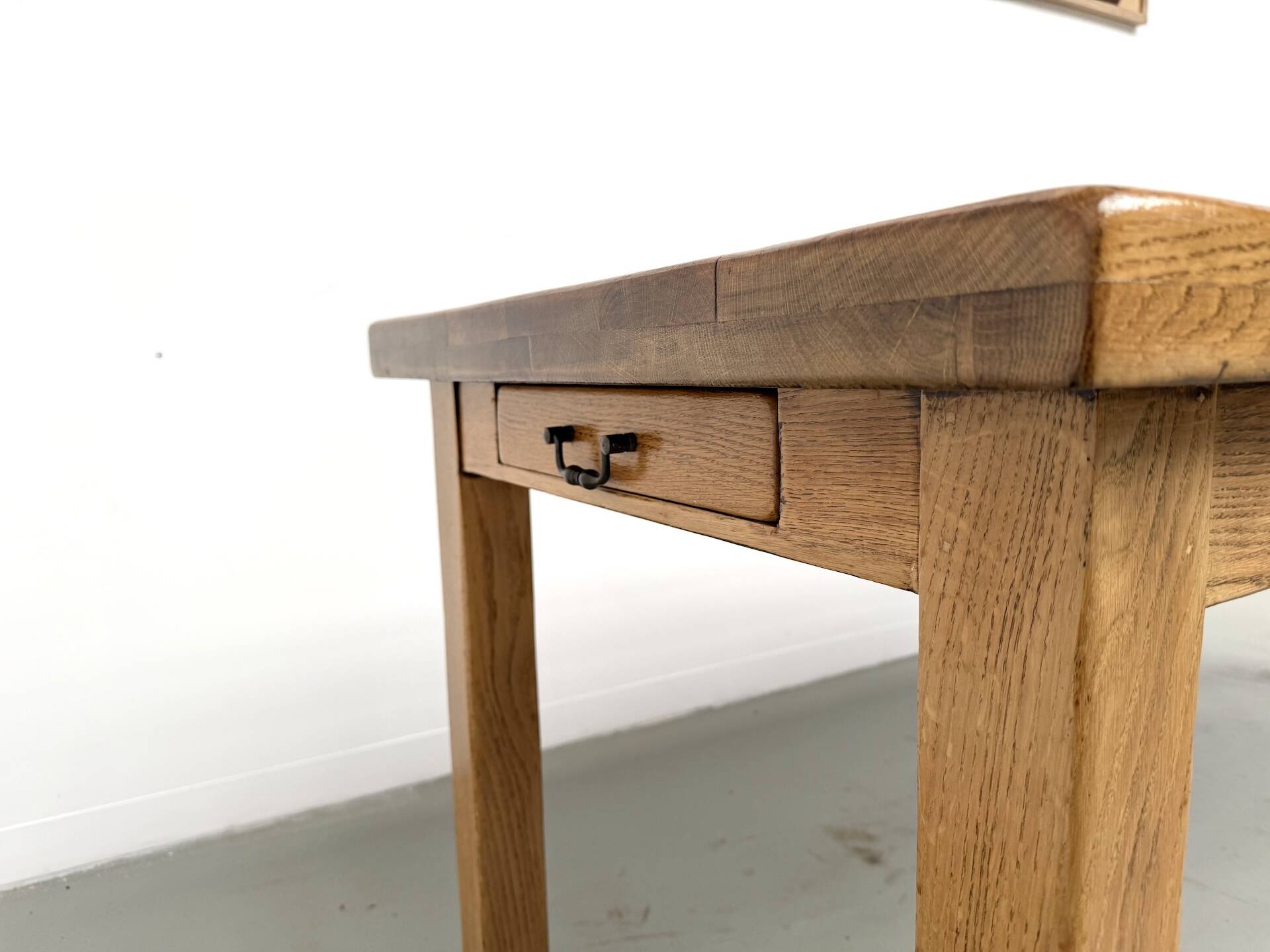 Solid oak farmhouse table, square legs.