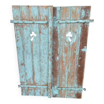 Pair of green wooden shutters
