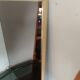 Vintage mirror in gilded brass and smoked glass. circa 1970