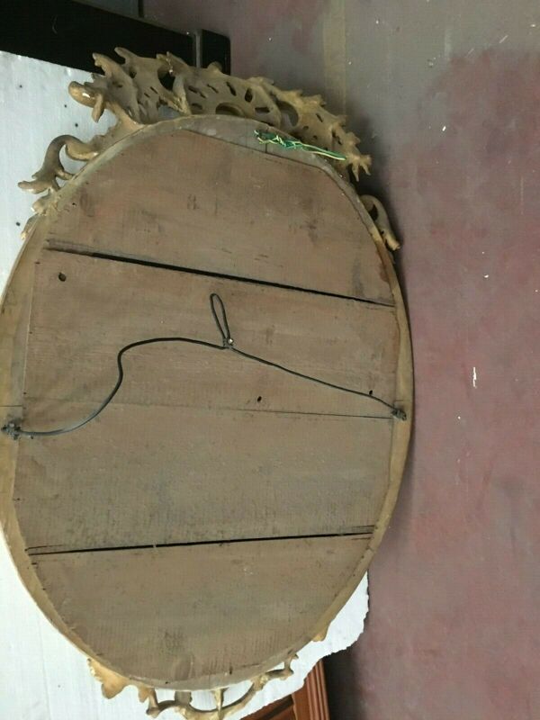 Miroir ovale a fronton en bois et stuc doré Glace ovale biseautée Napoléon III - 80x120cm