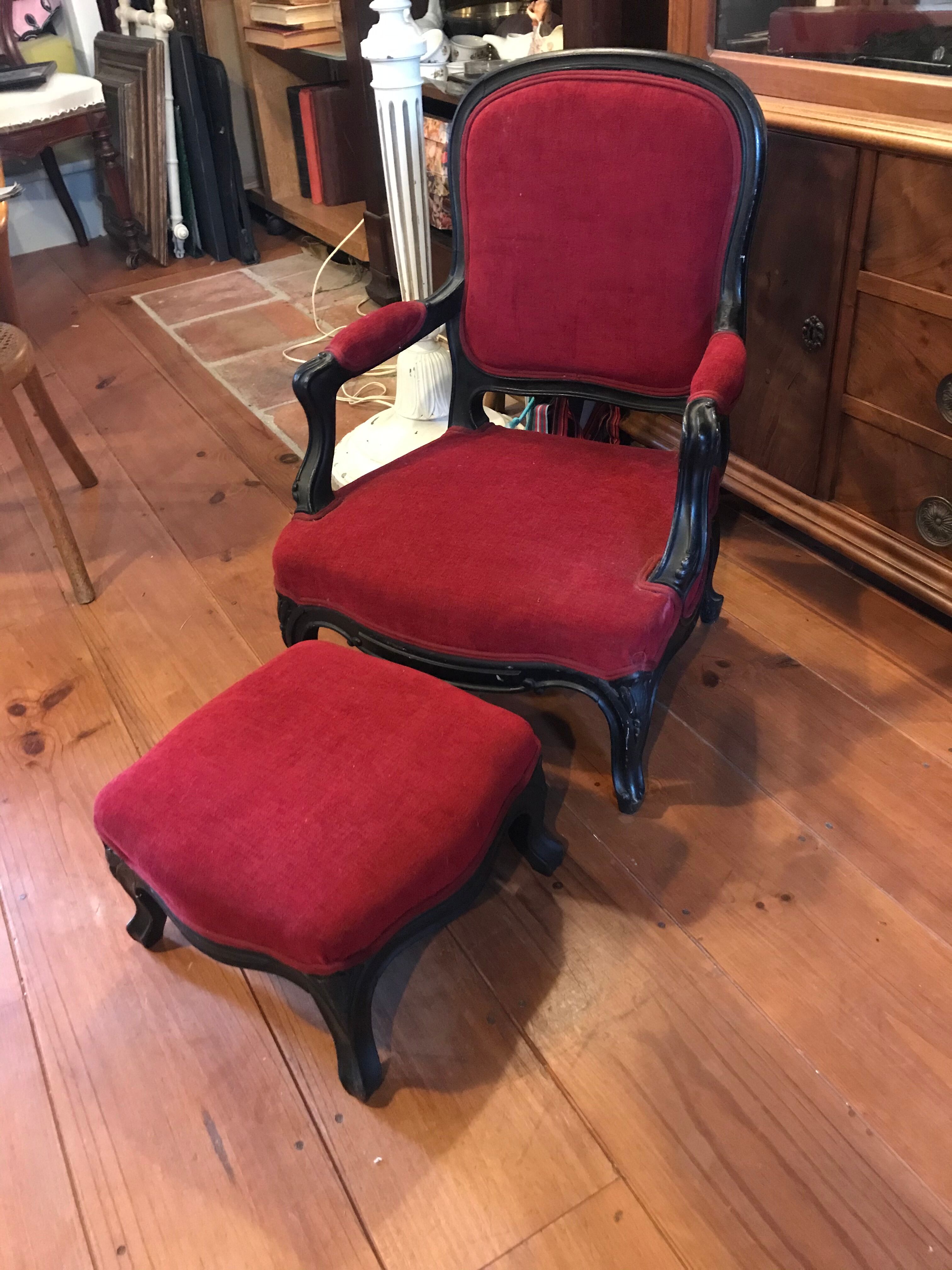 Old children's armchair with foot rests