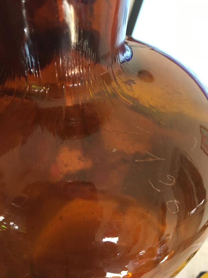 Old thick glass amber bottle