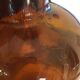 Old thick glass amber bottle
