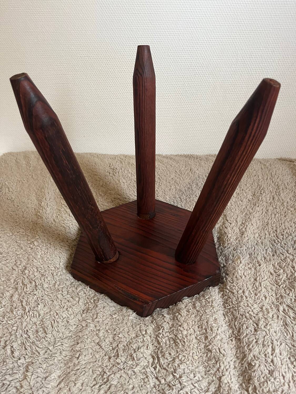 Wooden tripod stool in mountain chalet style