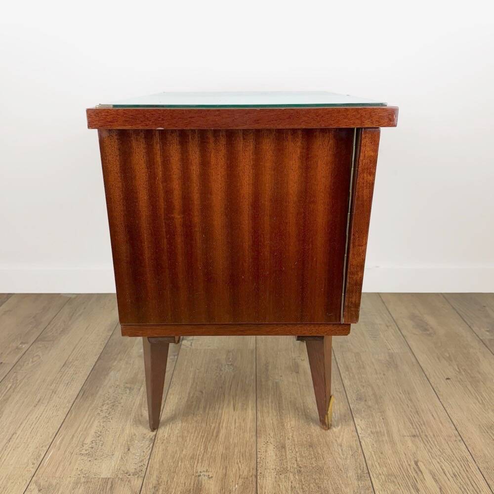 1950s bedside table in varnished wood veneer and brass.