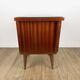 1950s bedside table in varnished wood veneer and brass.
