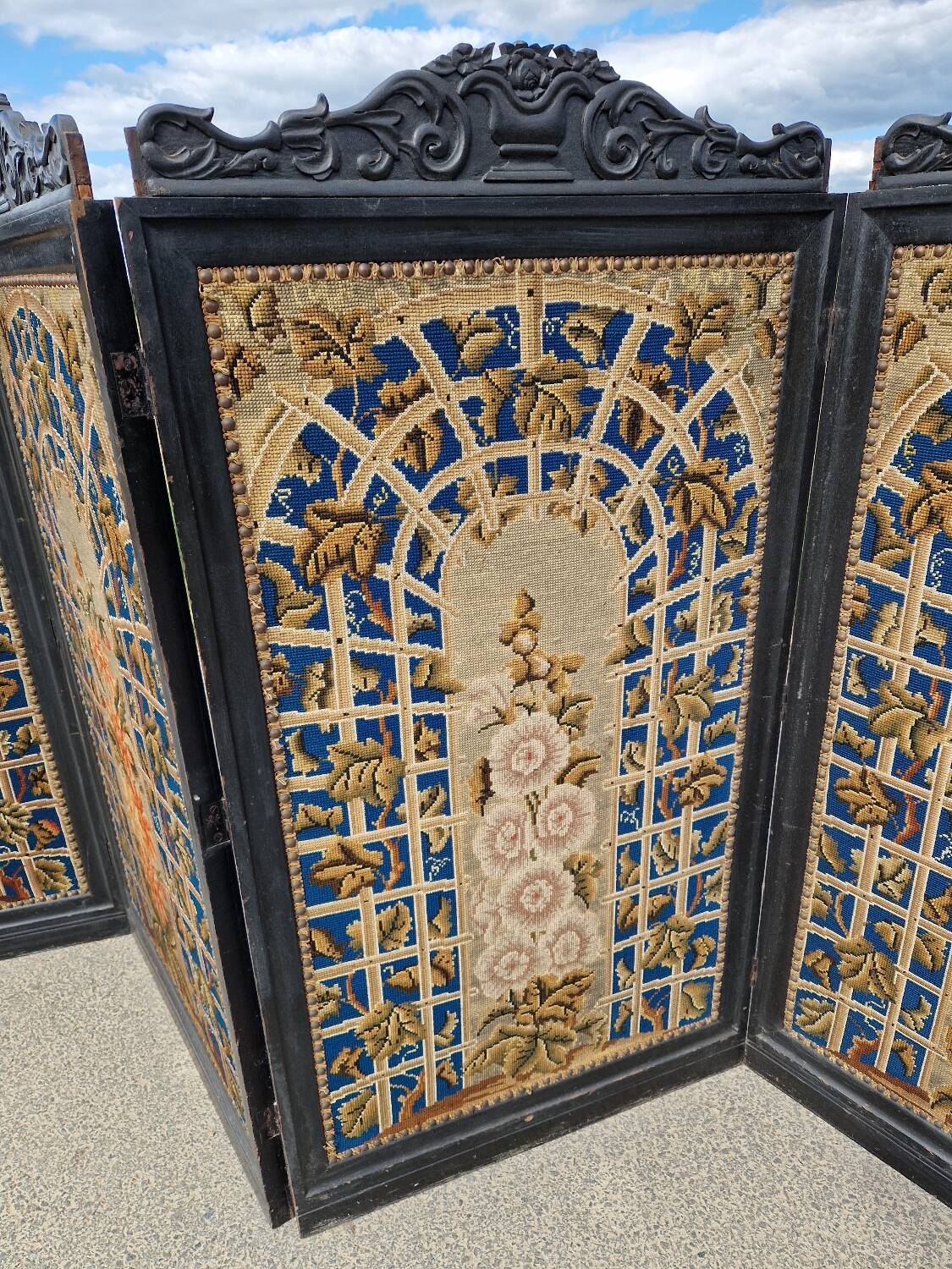 Folding screen in black-painted wood, 19th century
