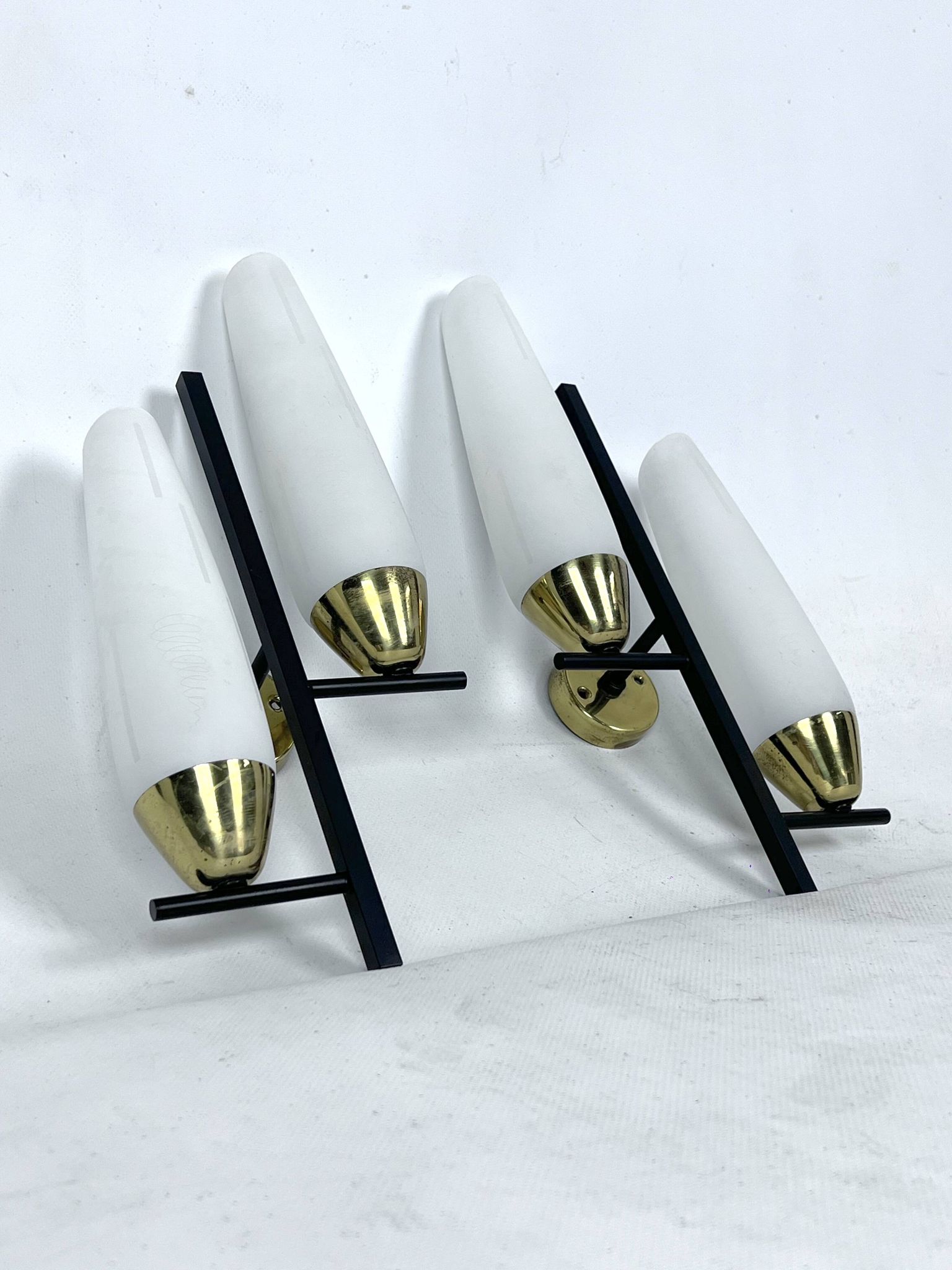 Mid-Century pair of double lights sconces in brass and opaline glass. Italy 1950s