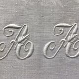 Tablecloth and 12 linen towels marked AA
