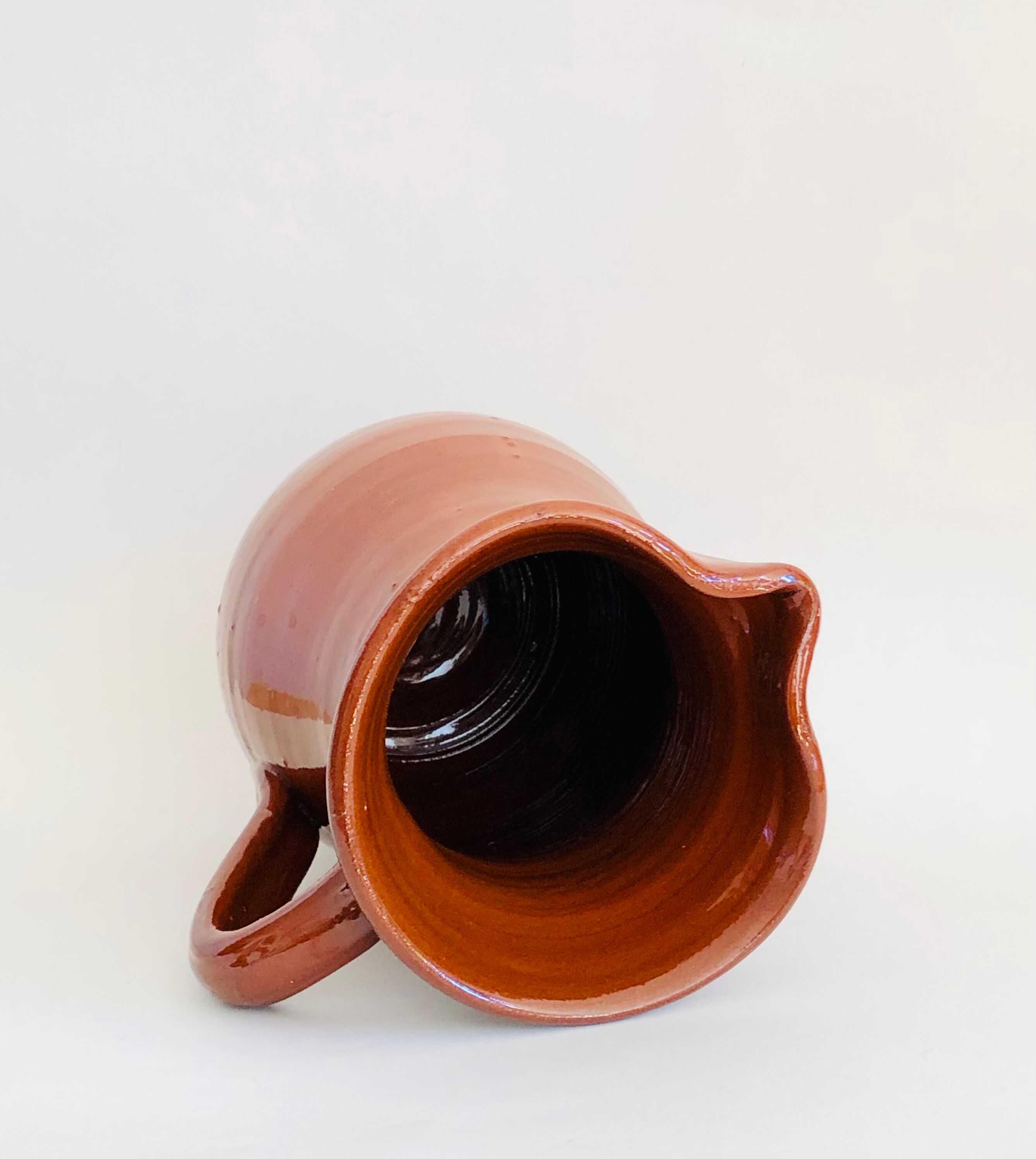 Vintage pitcher in glazed earth